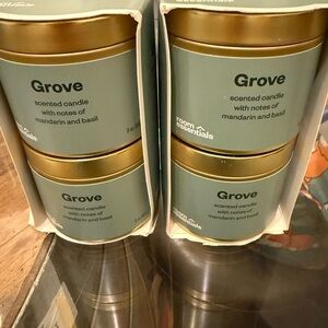 New 4 pack. Room Essentials Grove Scented Candle, mandarin and basil.